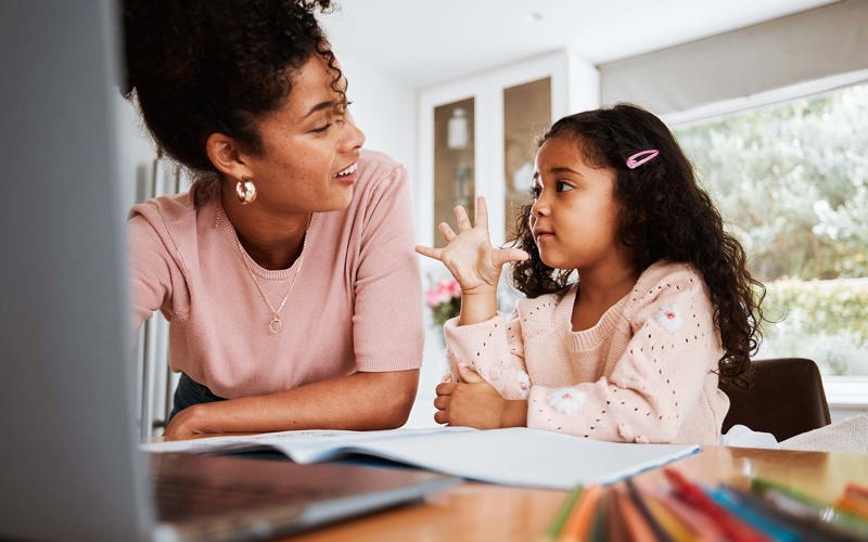 Math homework, mother and child with a laptop, counting and studying together in a house. Happy, talking and a little girl with an answer for education with a mom and a pc for elearning and knowledge